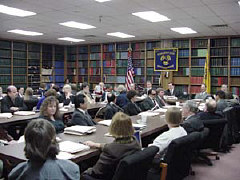Dr. Maurer speak to a large group of people in the NFB conference room.