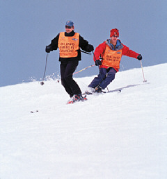 Skiing guide Mark Masto and blind student Mark Davis in action