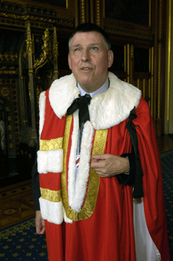 Lord Colin Low is pictured here wearing the official robe of members of the House of Lords.