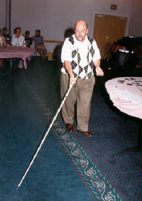 Joe Cutter demonstrates some cane techniques at a workshop for parents.