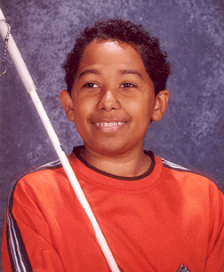 Jordan Richardson proudly displaying his cane in his school photo in 2004.