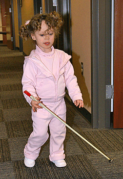 Kendra walking with her cane. See Kendra's Sonar story.