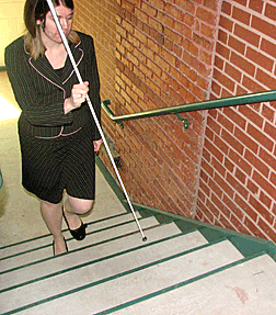 The pencil grip is also important in maneuvering in tight, enclosed spaces and is typically used when ascending or descending stairs. When ascending, the cane is elevated in front of the body to locate the step ahead. When descending, the cane is lowered to the step below in order to determine where to place the next footstep. 