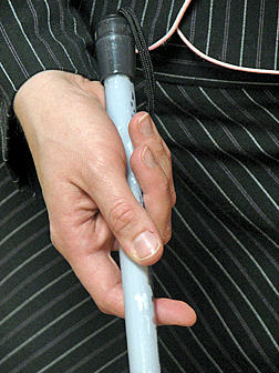 Here, the open palm technique is in use, but the position is closed. 