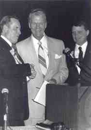 Paul Harvey with Kenneth Jernigan and Marc Maurer at the podium after speaking at the national convention.