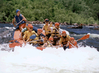A group of blind young adults white water rafting.