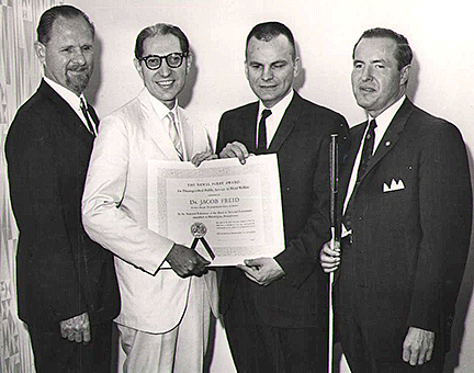 Pictured here are left to right: Jacobus tenBroek; Jacob Fried; Russell Kletzing; and Kenneth Jernigan. Dr. Jacob Freid is holding the Newel Perry Award certificate. Photo taken 1963.